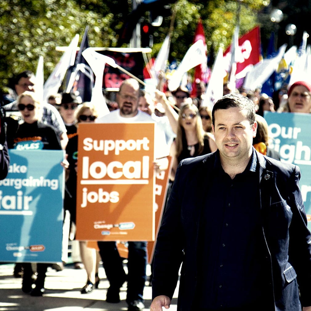 Alex White leading a rally in 2019 in support of improving workers rights, local jobs, enterprise bargaining and wages