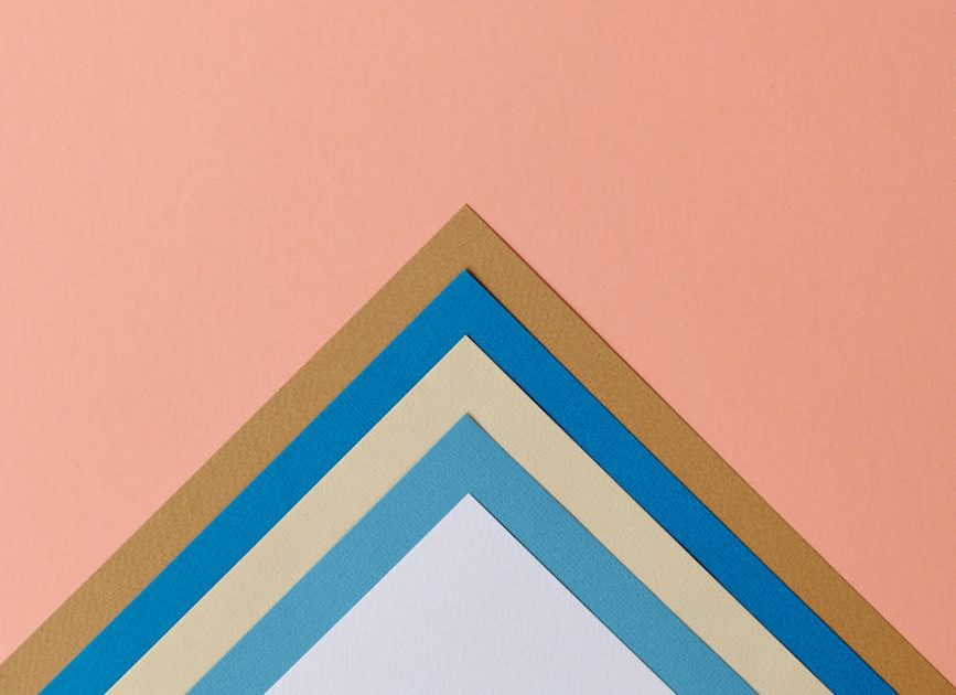 colorful triangles on pink background