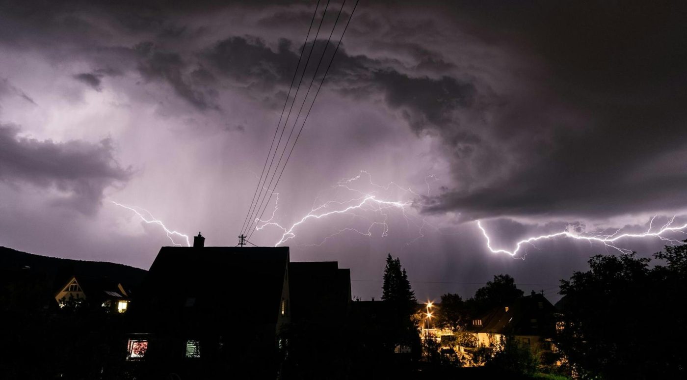 photo of house and lightning storm